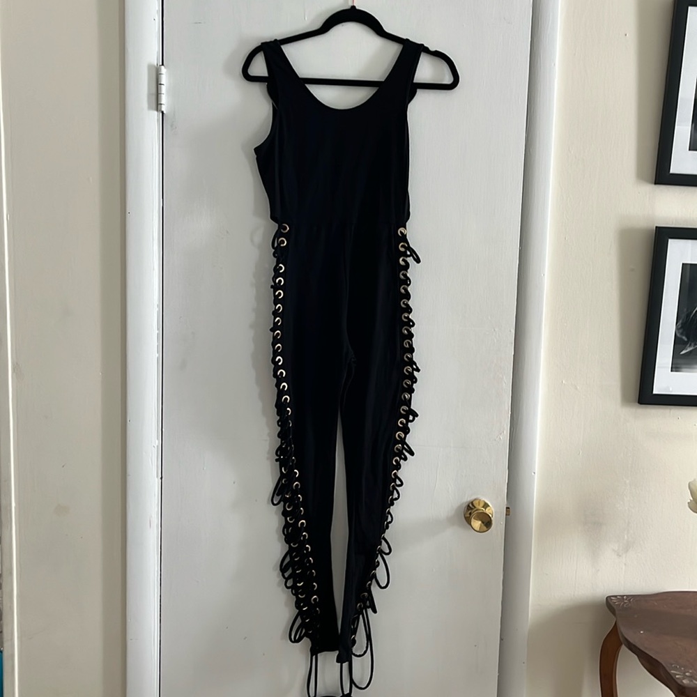 Sexy black jumpsuit with grommets down legs